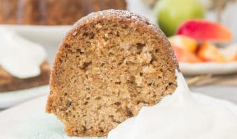 Full of spices and packed with apples, this fresh apple bundt cake with caramel glaze is the perfect fall dessert! #cake #apples