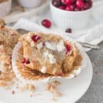 White chocolate cranberry crumb muffins are a taste of the holidays, and the best breakfast ever this time of year! recipe via itsybitsykitchen.com #crumbmuffins #breakfast #Christmas