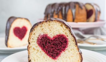 This hidden heart Valentine's Day cake is a fun and impressive dessert to serve the people you love--just don't tell the how easy it was to make! It would also be an adorable gender-reveal cake with pink or blue. recipe and how-to via itsybitsykitchen.com #cake #bundtcake #valentinesday #genderreveal