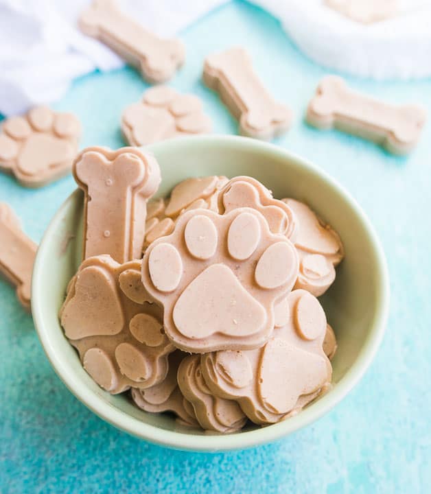 overhead shot of peanut butter banana ice cream for dogs in a green bowl