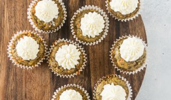 overhead view of mini carrot cake cupcakes for dogs (pupcakes) after they've been frosted