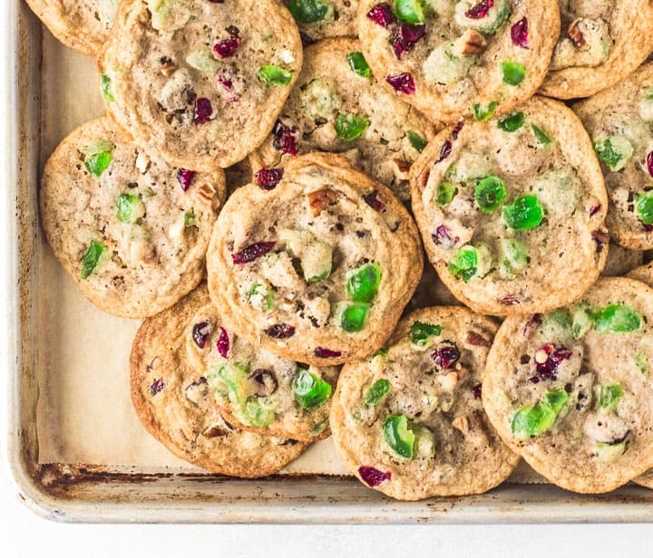 overhead photo of fruitcake cookies on a baking sheet