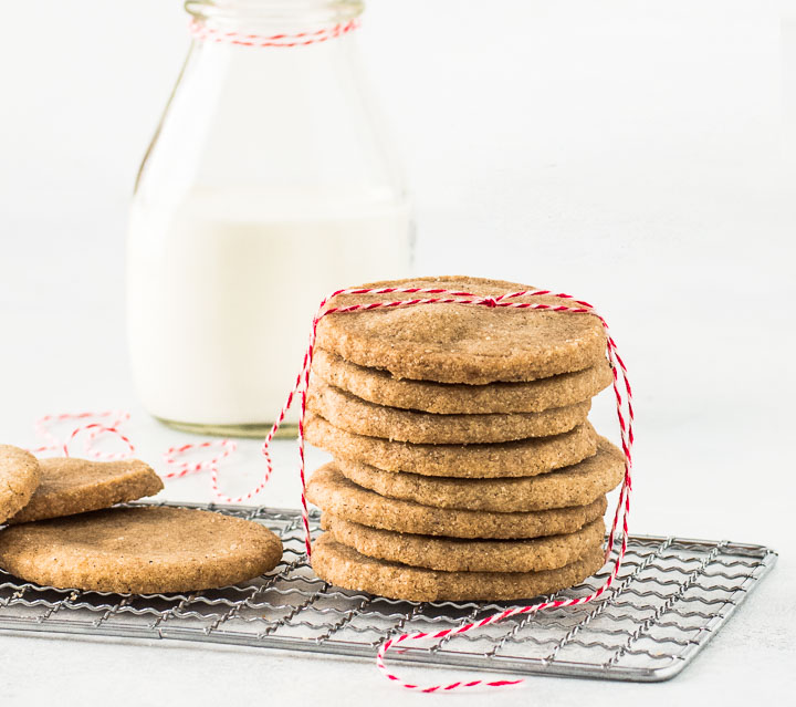stack of speculoos cookies on a a wire rack and tied with a piece of red string