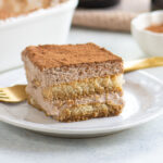 Square slice of beeramisu on a white plate.